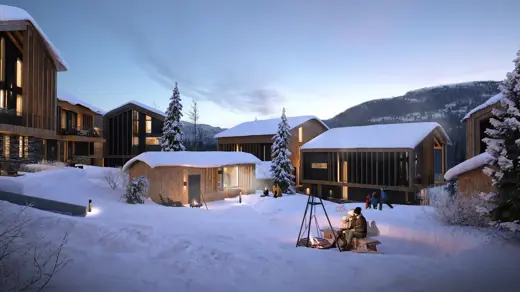 Bilde av hytter i snødekt landskap.